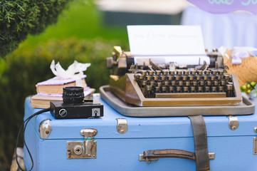 Old Camera and Typing Machine on Suitcase