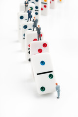 Domino effect or chain reaction concept of cascading errors or failure to make the right decisions