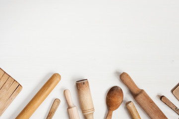 Kitchen utensils on the white wooden table