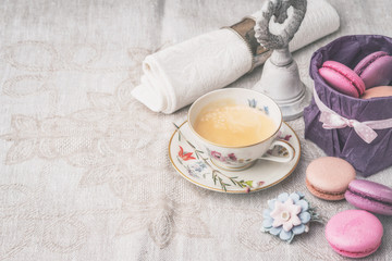 Cup of coffee with sweets and decorations