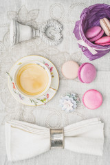 Cup of coffee with sweets and decorations top view