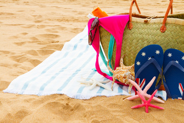 sunbathing accessories on sandy beach