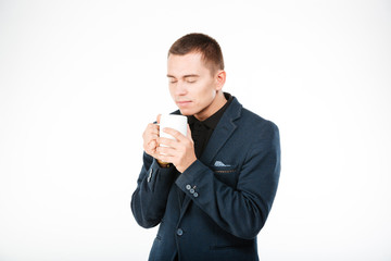 Businessman holding cup with tea