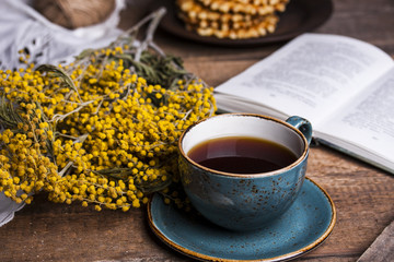 Cup of coffee on a wooden table