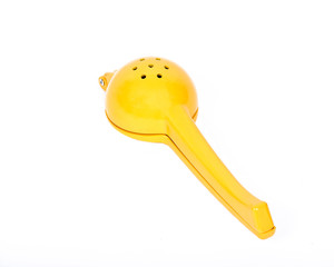 Yellow lemon squeezer separated on white background