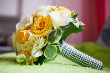 Wedding bouquet and wedding rings close-up