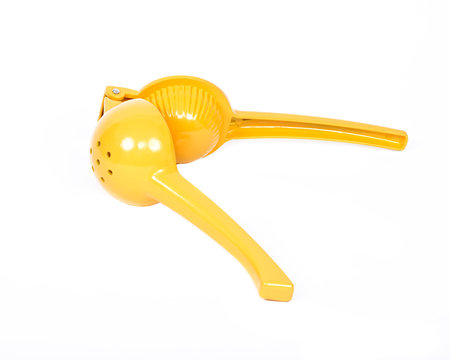 Yellow lemon squeezer separated on white background