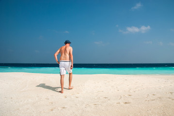 Fototapeta na wymiar Man in a tropical beach