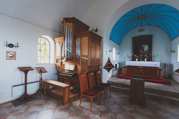 A classic catholic lutheran small church interior with no people inside