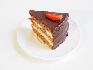 Layered chocolate cake with strawberry slice