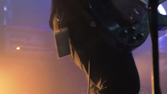 Guitarist playing on stage at the club, 4k