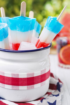 Red-white-and-blue popsicles on an outdoor table