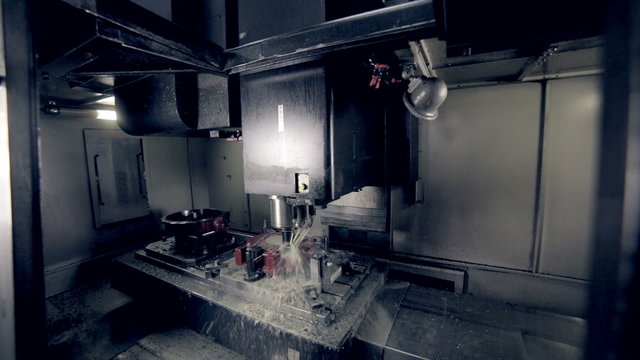 CNC Milling Machine Produces Metal Detail on Factory. HD.