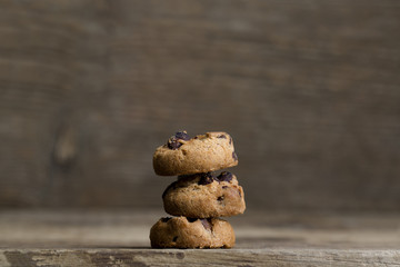 Brown cookies on wooden background