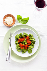 dish with Italian food, ravioli or tortelli on the table. cheese