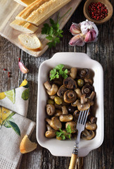Fried mushrooms with garlic and olives