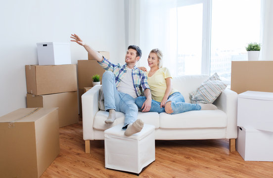 couple with boxes moving to new home and dreaming
