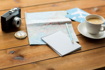 close up of notepad with map and travel tickets