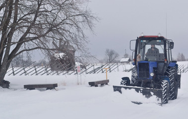 Fototapeta na wymiar snow removal in the countryside