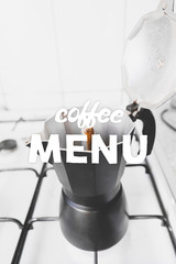 Opened coffee maker and hand drawn quote Coffee menu