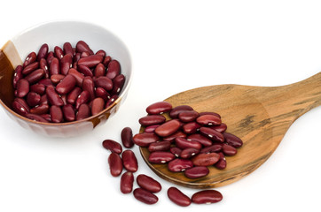 Red kidney bean in small bowl and wooden spoon