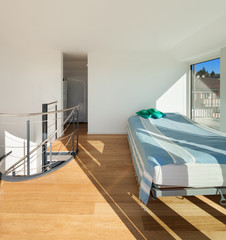 Interior, bright bedroom of a duplex,