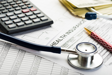 Health care costs. Stethoscope and calculator symbol for health