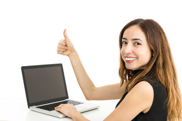 Woman with a laptop giving thumbs up