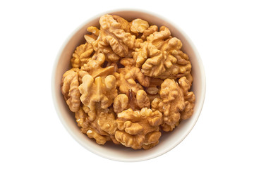 Walnuts in white bowl isolated on white background. Top view.