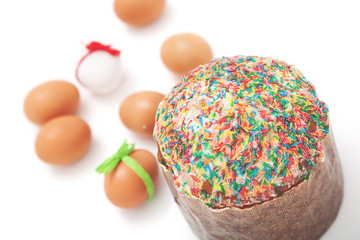 Easter cake and Easter eggs on white background
