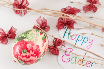 Decoupage Easter eggs and small ribbons