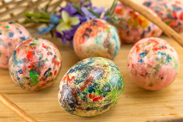 Painted Easter eggs falling out of basket
