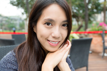 Young woman in outdoor restaurant