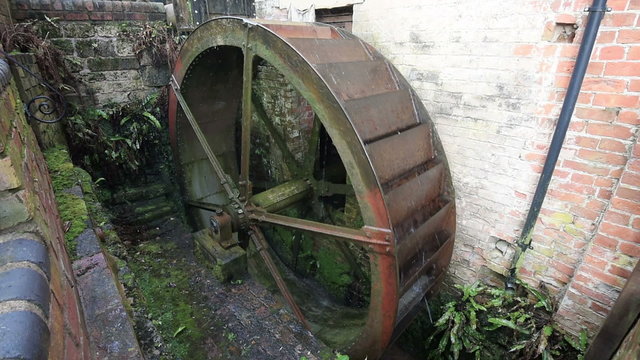 Old water wheel used to turn a mill stone