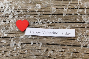 Little red heart on vintage paper and happy Valentine's day message