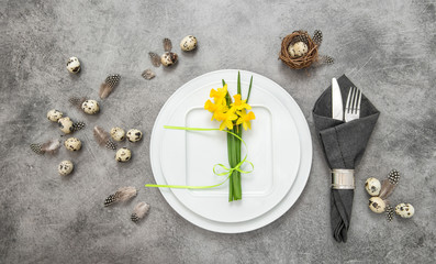 Easter table setting decoration eggs and flowers