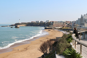 great beach and the center of Biarritz view of the lighthouse in the distance