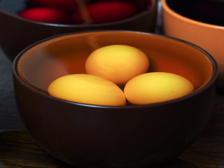 Preparing for the holiday Easter. The process of painting eggs with food coloring 