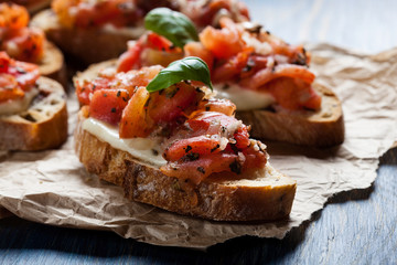 Italian bruschetta with roasted tomatoes, mozzarella cheese and