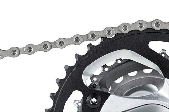 bicycle chain on gear of crank set isolated on white background