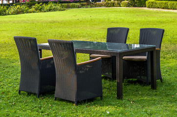 Rattan furniture, table and chairs, cushion  outdoors