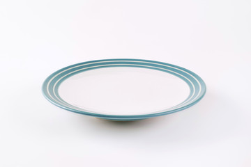 white and blue empty plate