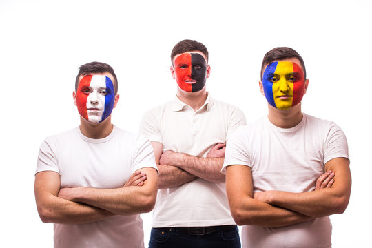 France, Albania, Romania Football fans of national teams with crossed hand look at camera on white background. European 2016 football fans concept.