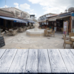 View on typical Cyprus street over old light wooden table or boa