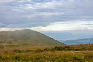 morning fog covers the mountains top