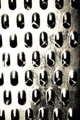 The surface of metal grater for background. Toned