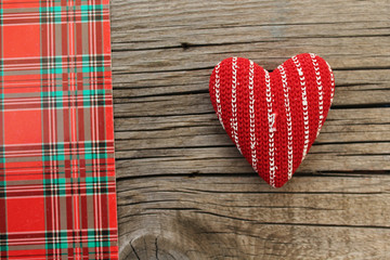 Red heart, plaid pattern and copy space
