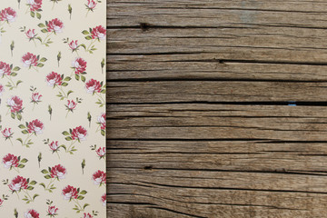 Flower pattern on wooden background - copy space