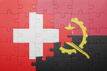 puzzle with the national flag of angola and switzerland