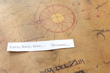 Love and dream message on map background - travel concept